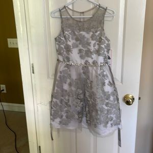 Fancy silver girls party dress with flower appliqué
